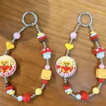 Customizable Yummy White Rabbit Strawberry Inflatable Pouch Keychain, cute strawberry-shaped storage bag charm with bear doll inside