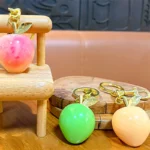 Peach Resin Keychain Pendant, glossy resin fruit bag charm with gold metal hardware