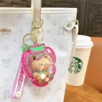 Customizable Yummy White Rabbit Strawberry Inflatable Pouch Keychain, cute strawberry-shaped storage bag charm with bear doll inside