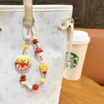 Customizable Yummy White Rabbit Strawberry Inflatable Pouch Keychain, cute strawberry-shaped storage bag charm with bear doll inside