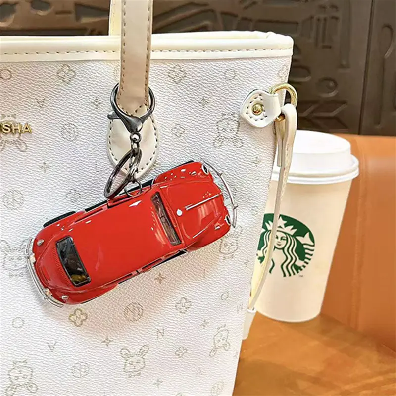 This Beetle Two-Door Toy Car Keychain is a classic vintage model car pendant highly restored from the iconic Beetle vehicle. The two side doors can be opened freely, bringing interactive playability as well as decorative value. We supply multiple vibrant color selections including black, yellow, red, white, blue and pink to meet diverse market preferences. Made with exquisite craftsmanship, the mini car model features delicate metallic luster and smooth texture. Equipped with durable keyring clip, you can hang it on backpacks, handbags and keys conveniently. It is a popular stress relief toy for students, perfect merchandise for claw machines, gift shops, carnival prizes and novelty retail gifts. H2: Factory Wholesale & Custom Service Multiple classic color variants in stock Eco-friendly sturdy plastic & alloy material Direct factory supply, support OEM & ODM custom printing Strict quality inspection for bulk claw machine orders Stable short lead time for large wholesale demands Fast support for all buyer inquiries H2: Core Product Features Highly restored classic Beetle two-door car model Openable side doors for interactive fun Rich color options: black, yellow, red, white, blue, pink Exquisite finish with metallic texture Dual function: collectible model toy & portable bag pendant Hot-selling item for claw machines, student gifts and retail merchandise