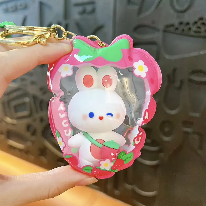 Customizable Yummy White Rabbit Strawberry Inflatable Pouch Keychain, cute strawberry-shaped storage bag charm with bear doll inside