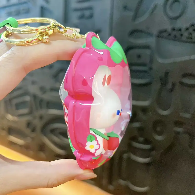 Customizable Yummy White Rabbit Strawberry Inflatable Pouch Keychain, cute strawberry-shaped storage bag charm with bear doll inside