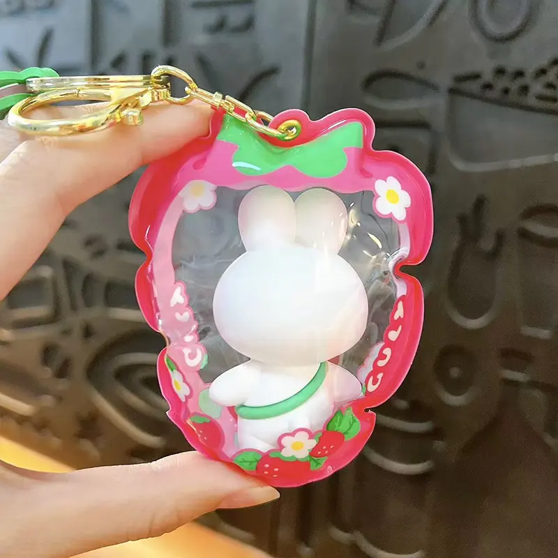 Customizable Yummy White Rabbit Strawberry Inflatable Pouch Keychain, cute strawberry-shaped storage bag charm with bear doll inside