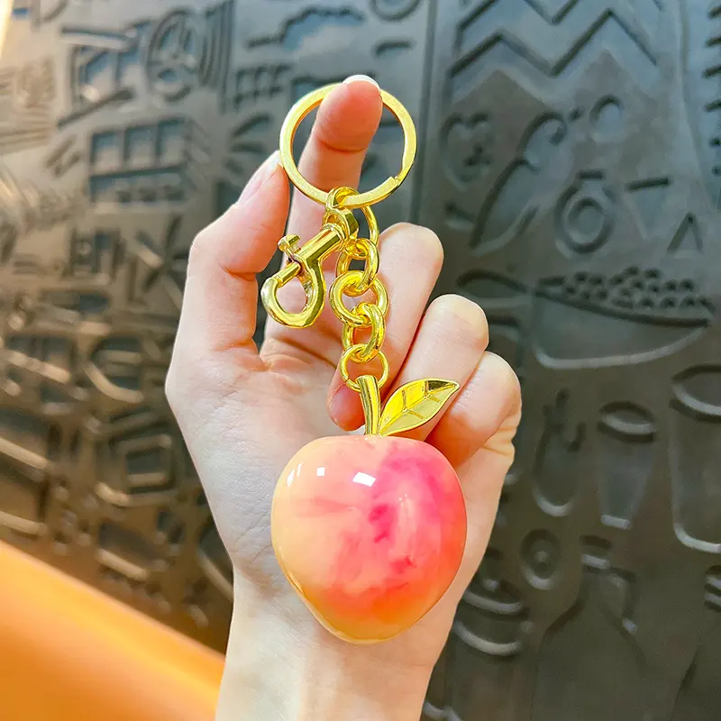 Peach Resin Keychain Pendant, glossy resin fruit bag charm with gold metal hardware