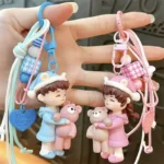 bear-hugging doll matching couple keychain, cute resin doll bag charm with braided lanyard