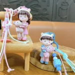 bear-hugging doll matching couple keychain, cute resin doll bag charm with braided lanyard