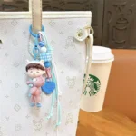 bear-hugging doll matching couple keychain, cute resin doll bag charm with braided lanyard