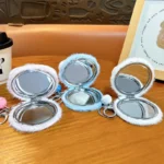 Cute Plush Panda Mirror Bag Charm Keychain Fluffy Cartoon Panda Plush Pendant With Folding Double‑Sided Makeup Mirror And Bell