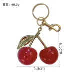 glitter cherry keychain, shiny resin fruit bag pendant with golden metal leaf