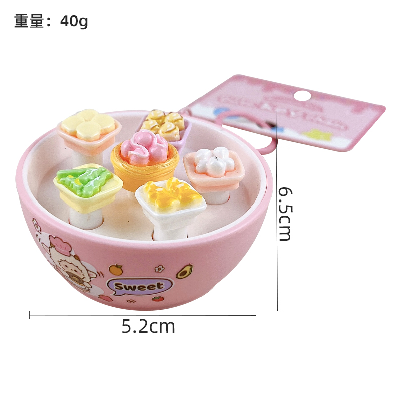 Hand pressing interactive mini bread buttons on whack-a-mole stress relief keychain