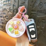 Pink bowl mini bread whack-a-mole push pop fidget toy keychain