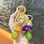 strawberry rotating fidget keychain cute fruit spinner stress relief bag charm pineapple pendant