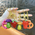 strawberry rotating fidget keychain cute fruit spinner stress relief bag charm pineapple pendant